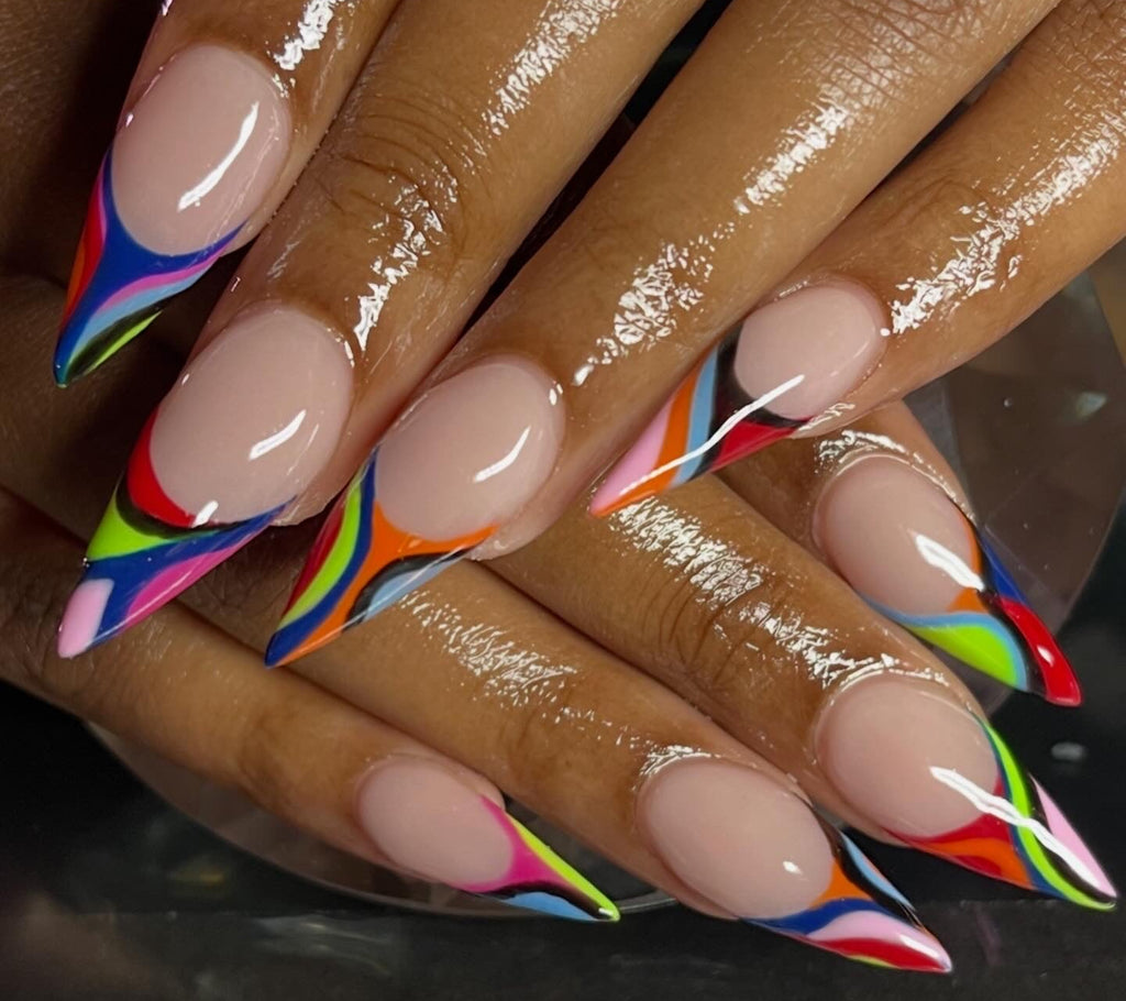 Nails with rainbow designs on a dark background pucci
